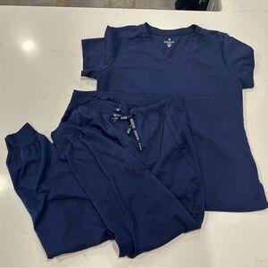 Women’s navy blue Medcouture scrubs- top: L, bottoms: M